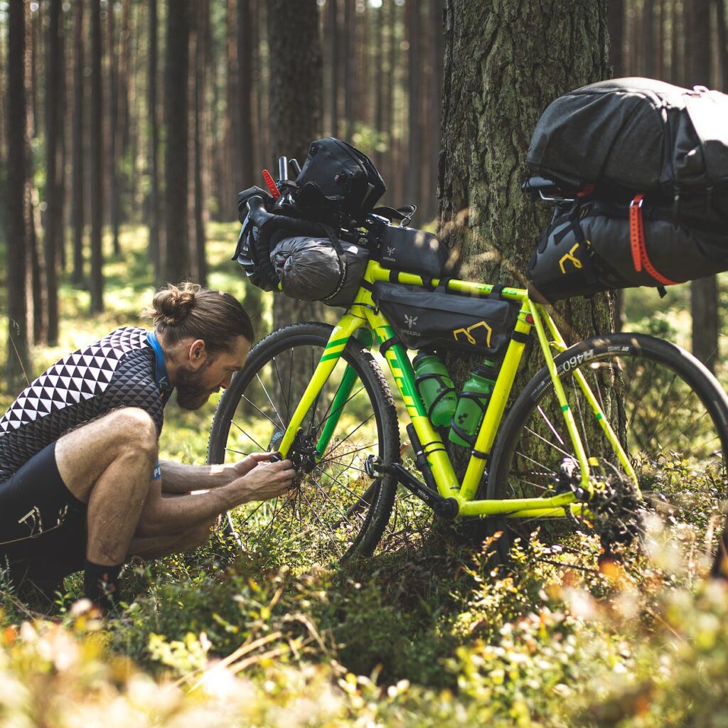 a man fixing his bicycle